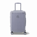 Front view of the GYL Intemporelle silver hard suitcase, embossed logo and 360 degree wheels. #silver_color