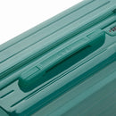 Rigid top handle of the water green GYL Intemporelle suitcase with embossed logo on the top. #color_green