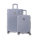 Deux valises rigides GYL Intemporelle argent, format cabine et soute, avec poignée trolley déployée. #couleur_argent