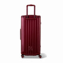 Dos de la valise trunk GYL XL rouge foncé avec trolley télescopique sorti et logo embossé. #couleur_rouge foncé
