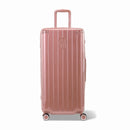 Valise trunk GYL taille XL en polycarbonate rose gold vue de face, avec trolley déployé et roues 360°.  #couleur_rose gold