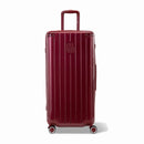 Valise trunk GYL taille XL en polycarbonate rouge foncé vue de face, avec trolley déployé et roues 360°.  #couleur_rouge foncé