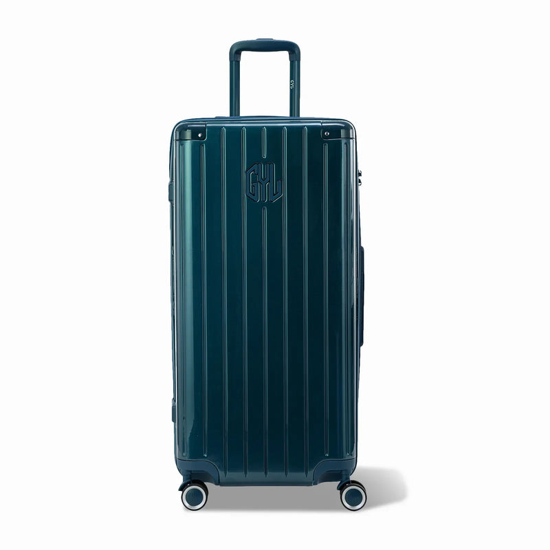 Maleta baúl GYL tamaño XL en policarbonato de abeto, vista frontal, con carro desplegado y ruedas de 360°.  #color_abeto