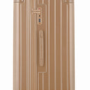 Détail de la serrure TSA et de la poignée latérale sur la valise trunk champagne. #couleur_champagne