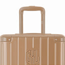 Zoom sobre el asa del trolley y el logo GYL de la maleta baúl champagne. #color_champán
