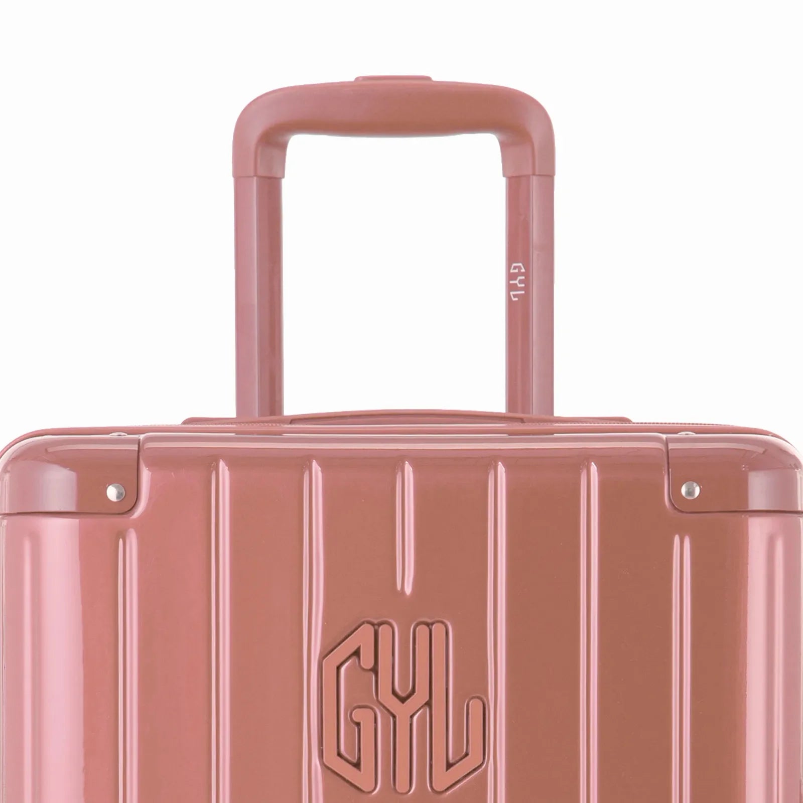 Zoom sur la poignée trolley et le logo GYL de la valise trunk rose gold. #couleur_rose gold