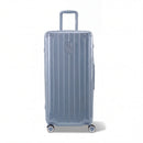 Valise trunk GYL taille XL en polycarbonate bleu gris vue de face, avec trolley déployé et roues 360°.  #couleur_bleu grisé