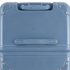 Vue du dessus de la valise trunk GYL bleu gris en polycarbonate, avec poignée centrale et coins renforcés. #couleur_bleu grisé