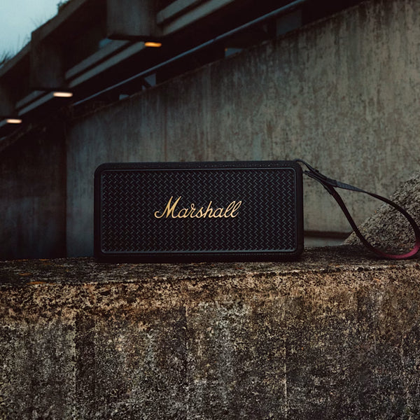 Marshall – Middleton II - Portable Speaker - Black & Brass, black speaker on a concrete wall, front view
