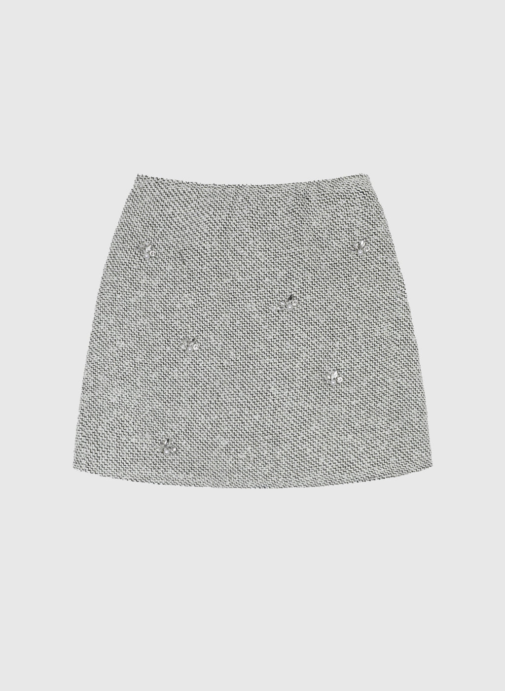 An'ge – Jupe Courte Jyma Ecru, mini-jupe en tweed gris clair avec des ornements brillants, vue de face