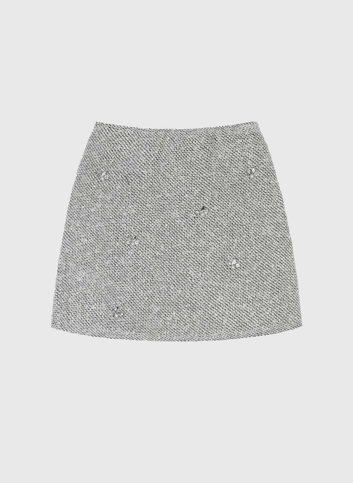 An'ge – Jupe Courte Jyma Ecru, mini-jupe en tweed gris clair avec des ornements brillants, vue de face