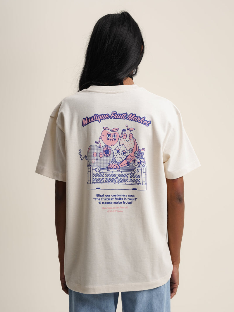 Woman wearing ecru Fruit Market t-shirt with cat image on back.