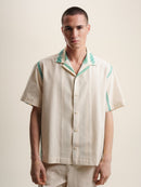 Green folklore short sleeve shirt with intricate patterns and vibrant colors. Perfect for a casual yet stylish look.