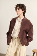 Manteau court en laine bouclette coloris marron, collection Garance Paris automne hiver 2025, esprit bombers revisité.