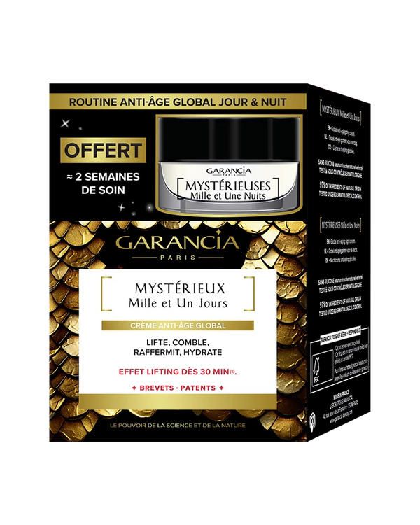 Embalaje de la caja dorada y negra que contiene el tarro de crema de día Mystérieux y una miniatura de noche gratis