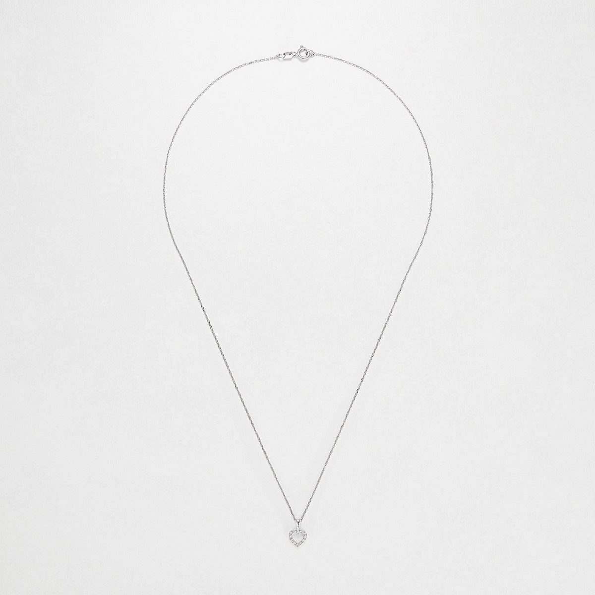 Pendentif Or Blanc 375/1000 "Mini coeur" D:0,04ct/12