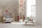 Lé Papiers De Ninon – Papier Peint Panoramique Manosque - Multicolore, fauteuil gris et table basse dans un salon lumineux