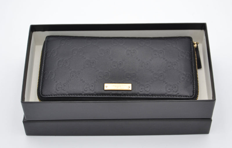 Cartera larga Gucci Zippy en cuero negro Guccissima