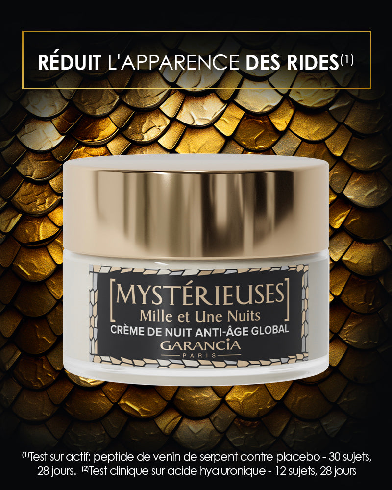 Jar of global anti-aging night cream with synthetic snake venom peptide on a background of golden scales