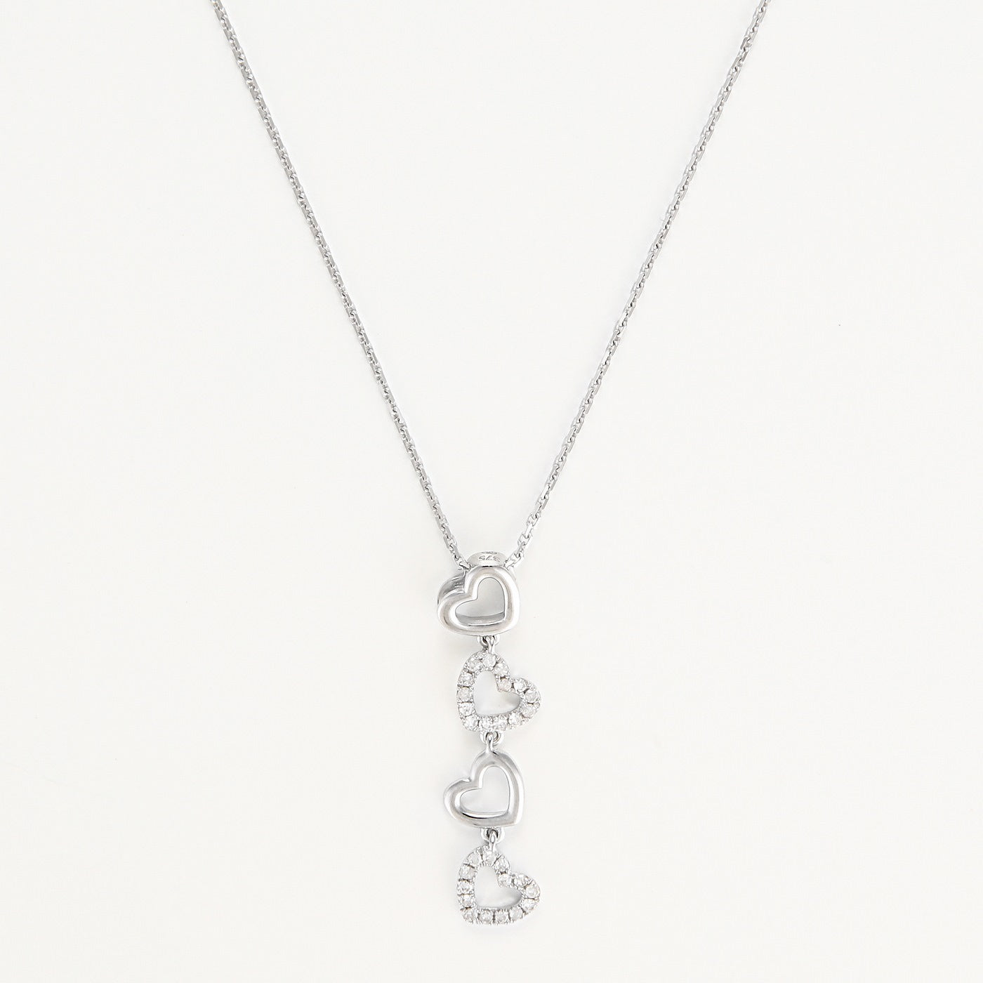Pendentif "4 Coeurs" Diamants 0,13/28 - Or Blanc 375/1000