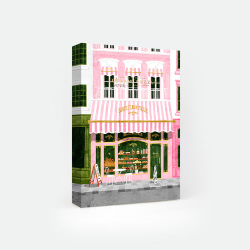 Pink Bakery jigsaw puzzle by All the Ways to Say – 1000-piece pastel Paris puzzle showing a charming pink bakery facade with cakes, cookies, and pastries.