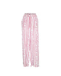 Pantalon June Rouge Framboise – Tatiane de Freitas – pantalon de plage avec une taille haute, jambes larges fluides, matière légère, poches, imprimé "Esprit d'été éternel", beachwear luxe femme Lyon