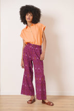 Pantalon ample et droit avec jambes évasées et passants à la taille tissu 100% coton avec motifs Ikat coloris grenat 