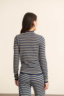 Le haut à la coupe ajustée à glisser sous une chemise ou un blazer, parfaite pour les superpositions sans effet de surépaisseur.