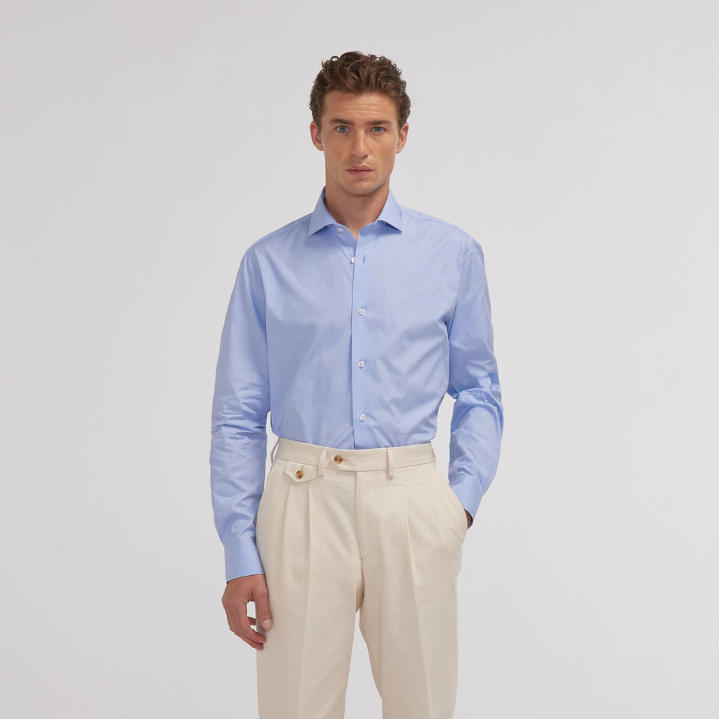 Hast – Blue Two-Ply End-on-End Shirt, male model wearing a blue shirt and beige trousers, front view