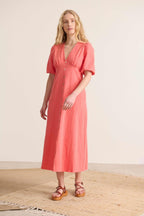 Robe à la longueur midi manches 2/4 élastiquées et légèrement bouffantes robe avec fente à l'avant 