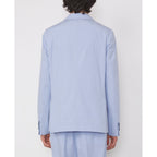 Officine Générale – Veste Arthus - Bleu Layette - Homme, homme de dos portant un costume bleu clair en tissu uni
