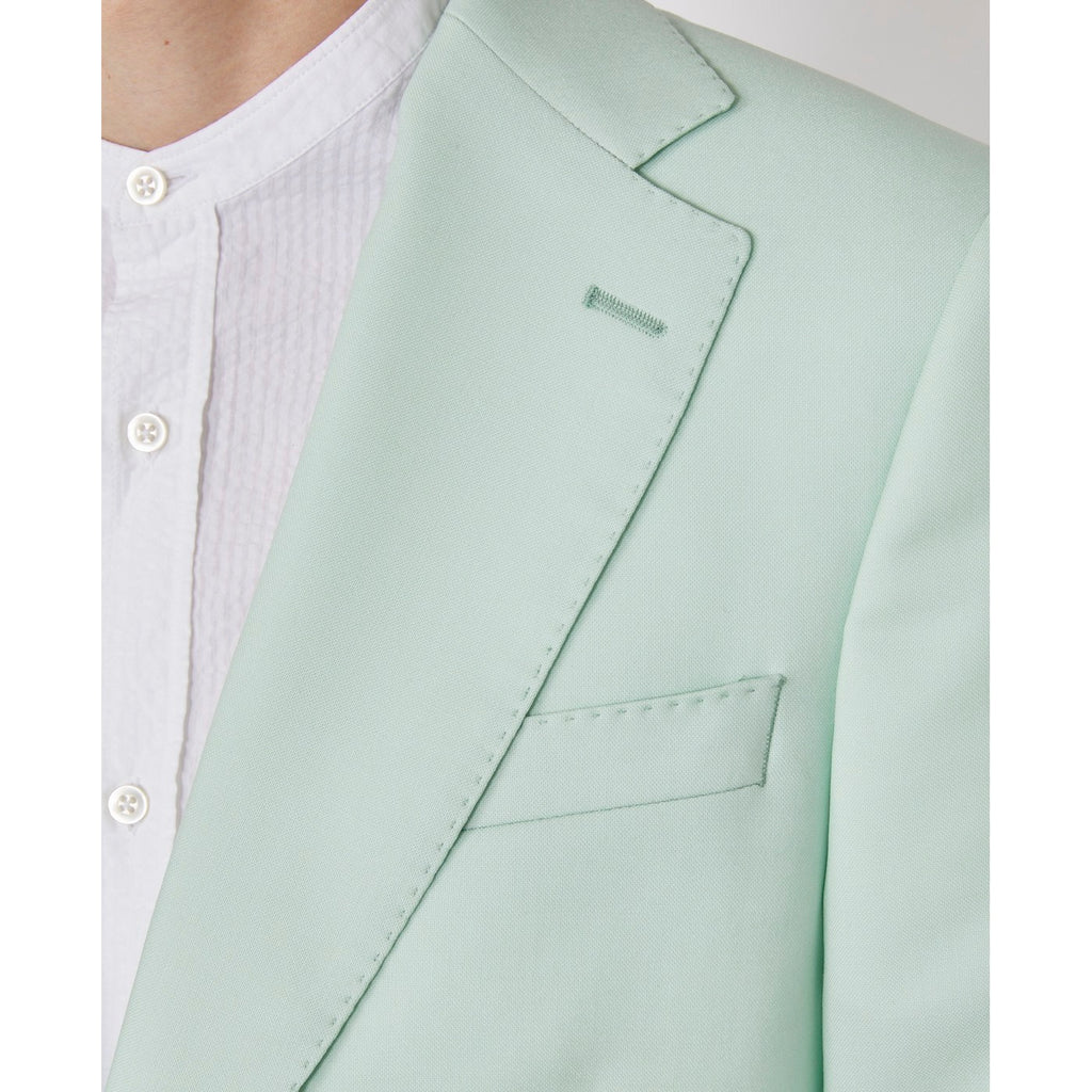Officine Générale – Veste Giovanni - Menthe - Homme, gros plan sur le revers et la poche d'une veste de costume vert d'eau