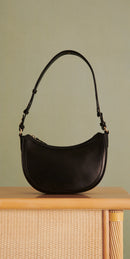 BOLSO SAULA MEDIA LUNA DE PIEL PETITE MENDIGOTE