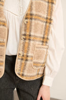 Matière effet peau de mouton 100 % polyester, imprimée jaune avec motif irrégulier sur toute la surface.