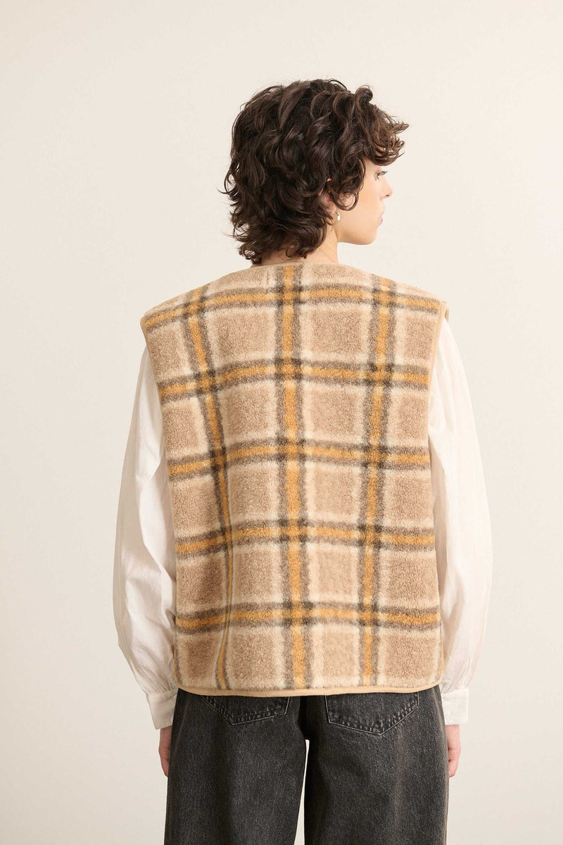 Veste sans manches pour femme de coloris jaune fabriquée en polyester avec un effet peau de mouton imprimé.