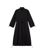 Black Kusama sustainable trench coat - silhouette 1