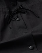 Black Kusama sustainable trench coat - silhouette 2