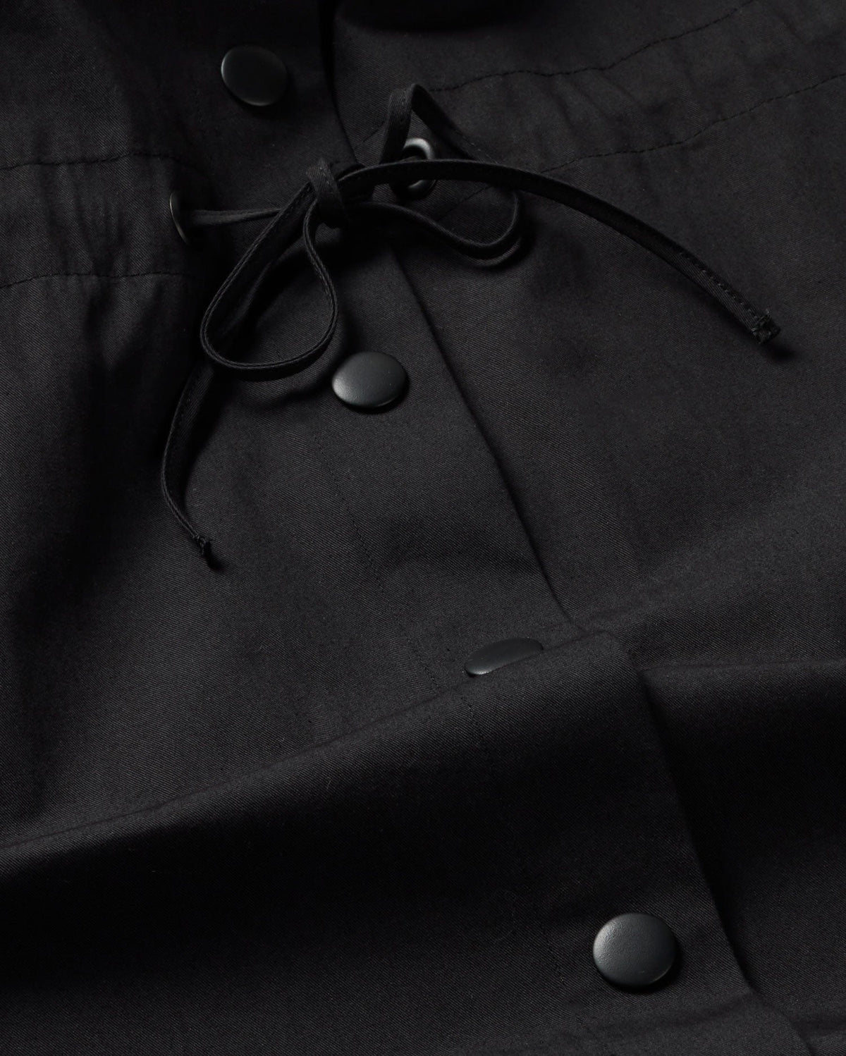 Black Kusama sustainable trench coat - silhouette 2