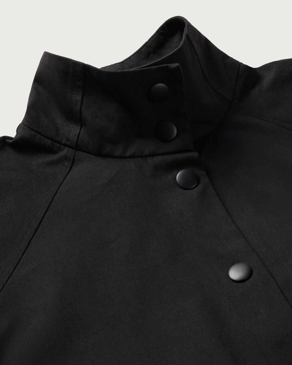 Black Kusama sustainable trench coat - silhouette 3