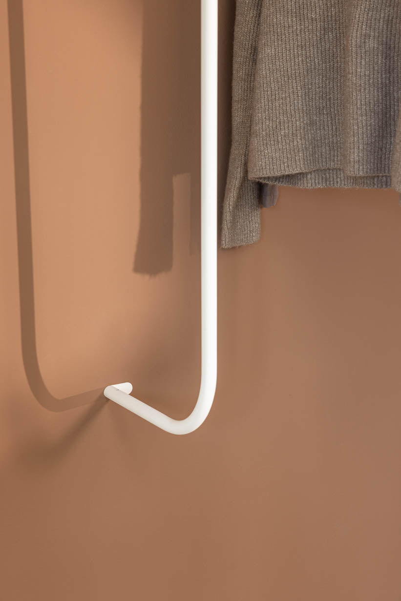 Details of the TAMINA wardrobe with gray Pullover in white metal.