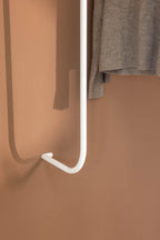 Details of the TAMINA wardrobe with gray Pullover in white metal.