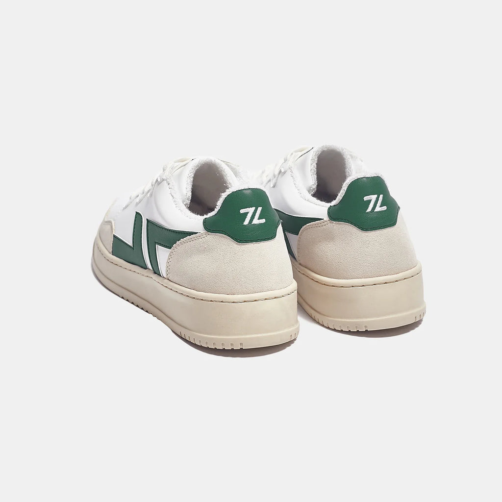 White and green sneakers with thick sole. These sneakers are vegan and made from recycled materials