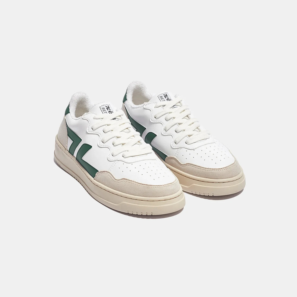 White and green sneakers with thick sole. These sneakers are vegan and made from recycled materials