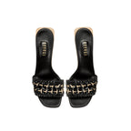 Almeria Black Wedge Sandal featuring a stylish woven strap design and sleek black finish.