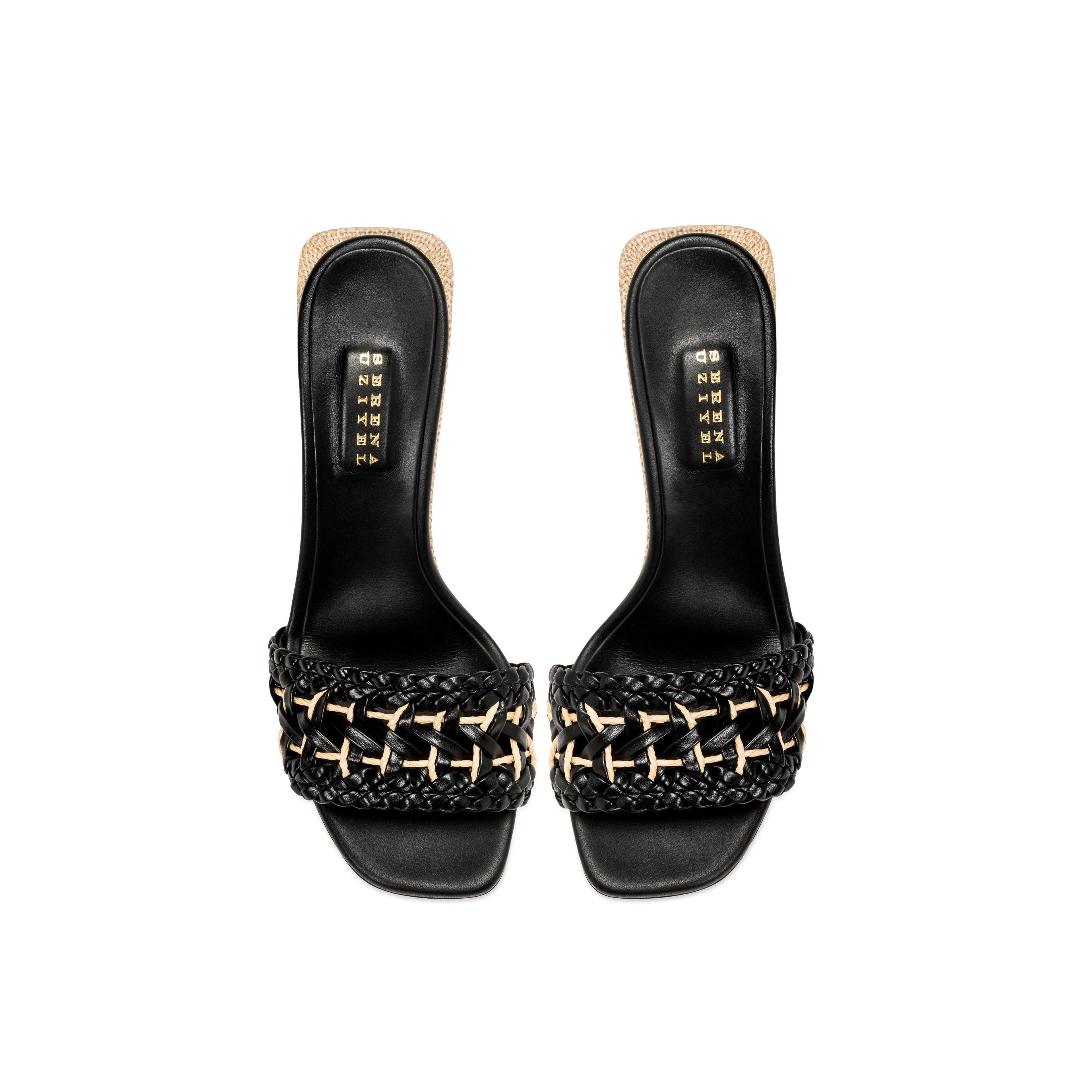 Almeria Black Wedge Sandal featuring a stylish woven strap design and sleek black finish.