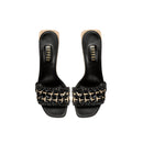 Almeria Black Wedge Sandal featuring a stylish woven strap design and sleek black finish.