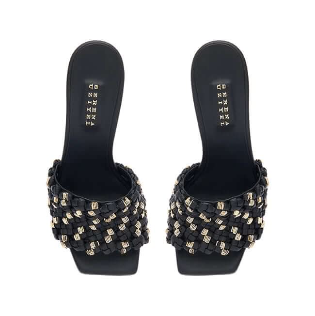 Aurnia Black High-Heel Sandal featuring a stylish woven design with gold accents, perfect for elevating any outfit.