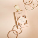 Lot de 14 élastiques cheveux fins Bachca en tons nude et pastel, discrets et résistants, parfaits pour des coiffures élégantes et naturelles.