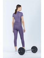 Women's tight-fitting sports top seen from behind