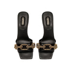 Catena Black Mid-Heel Sandal featuring a gold chain link design, elegantly crafted from Italian leather.